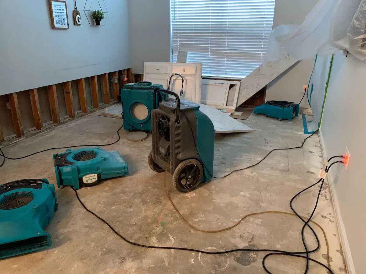 Dehumidifier in flood-cut room for Water Damage Restoration in Fenton